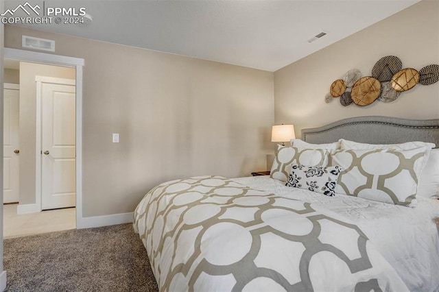 bedroom featuring light colored carpet