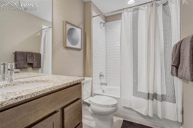 full bathroom with vanity, toilet, and shower / bath combo