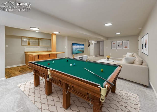 game room with hardwood / wood-style floors and billiards