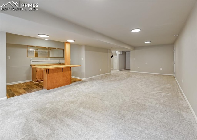 unfurnished living room with light carpet