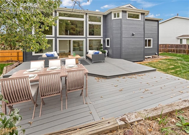 wooden terrace featuring an outdoor living space