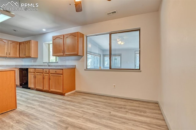 kitchen with ceiling fan, dishwasher, light wood-type flooring, and sink