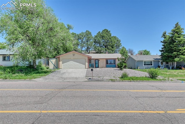 ranch-style home with a garage