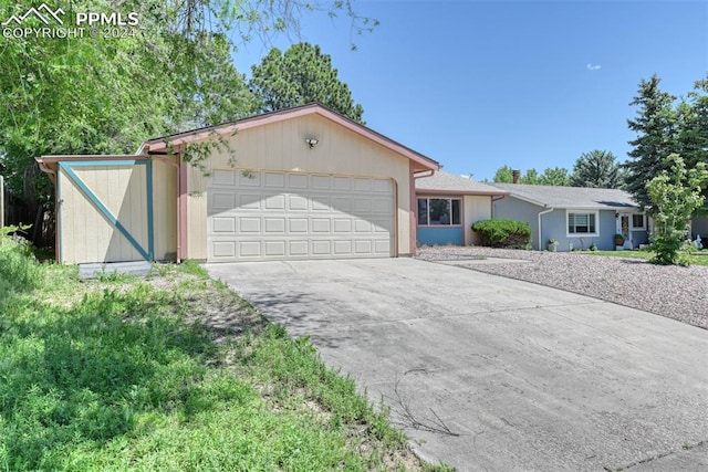 ranch-style house featuring a garage