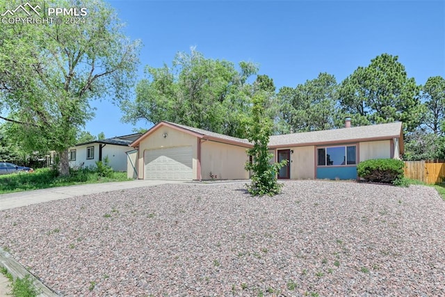 ranch-style home with a garage