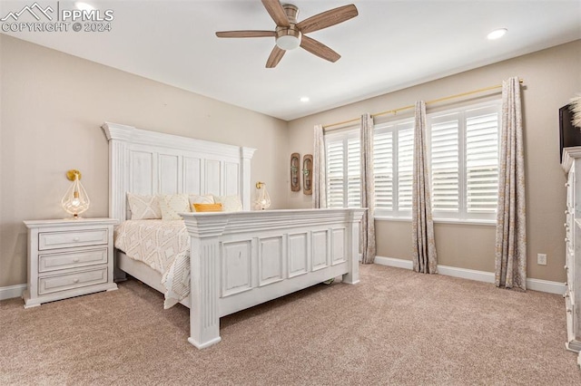 carpeted bedroom with ceiling fan