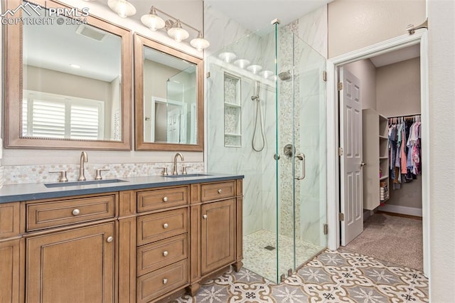 bathroom with vanity, tile patterned floors, and a shower with shower door