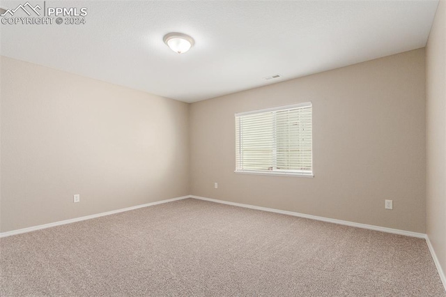 view of carpeted spare room