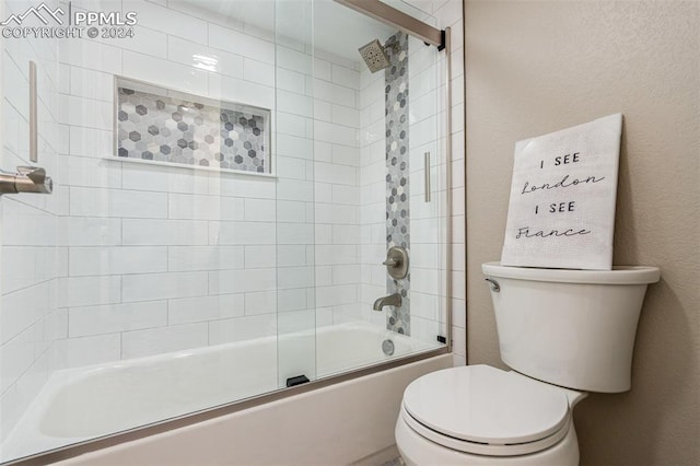 bathroom with toilet and enclosed tub / shower combo