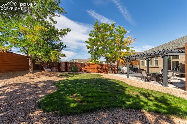 view of yard with a pergola and a patio area