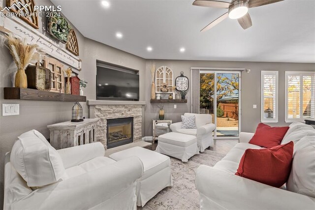 kitchen featuring appliances with stainless steel finishes, dark hardwood / wood-style floors, wall chimney range hood, and a large island with sink