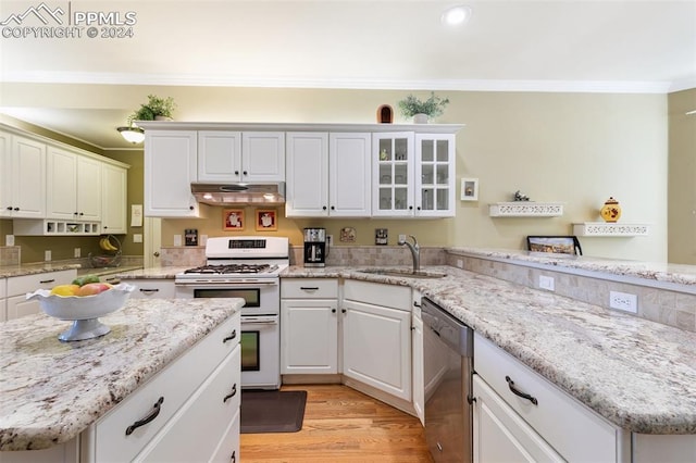 kitchen featuring sink, stainless steel dishwasher, white gas range, white cabinetry, and light hardwood / wood-style floors