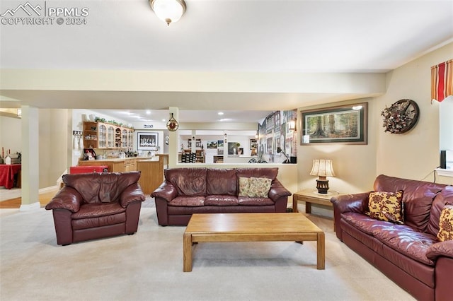 carpeted living room with bar area