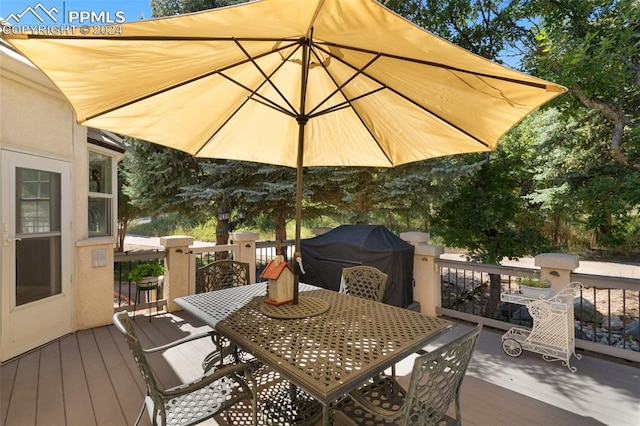 wooden terrace featuring area for grilling