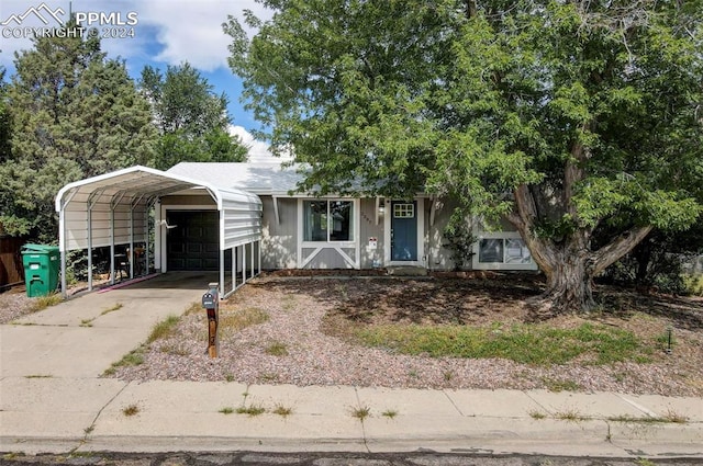 view of front of property with a carport