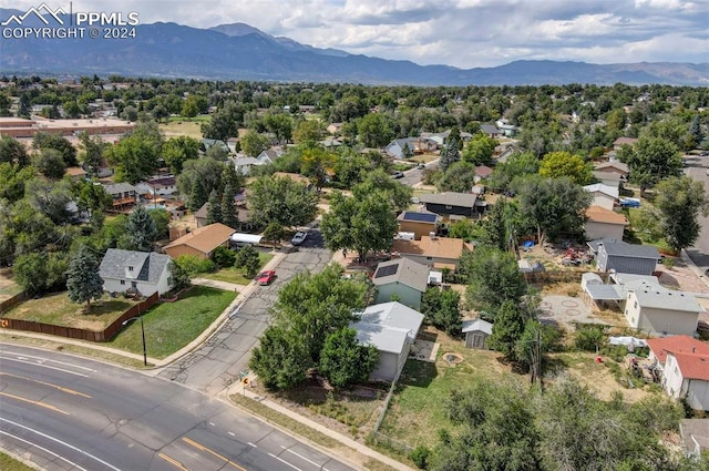 birds eye view of property with a mountain view