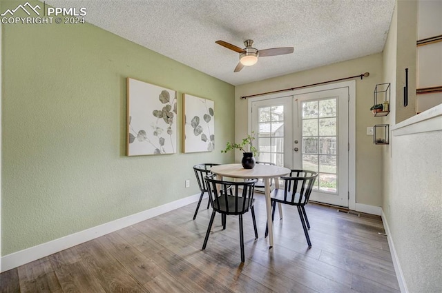 dining area featuring french doors, a textured ceiling, hardwood / wood-style floors, and ceiling fan