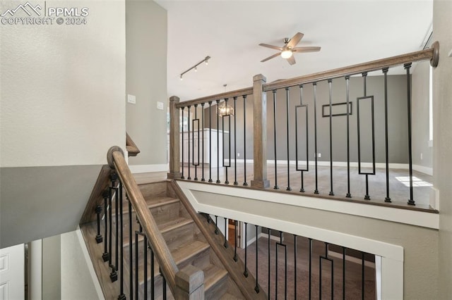 stairs with ceiling fan