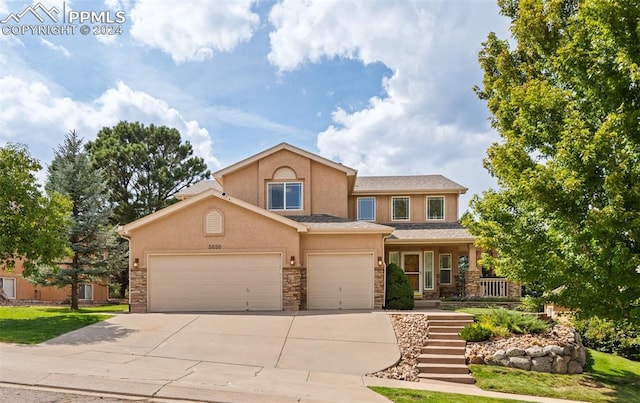 view of front of house with a porch and a garage