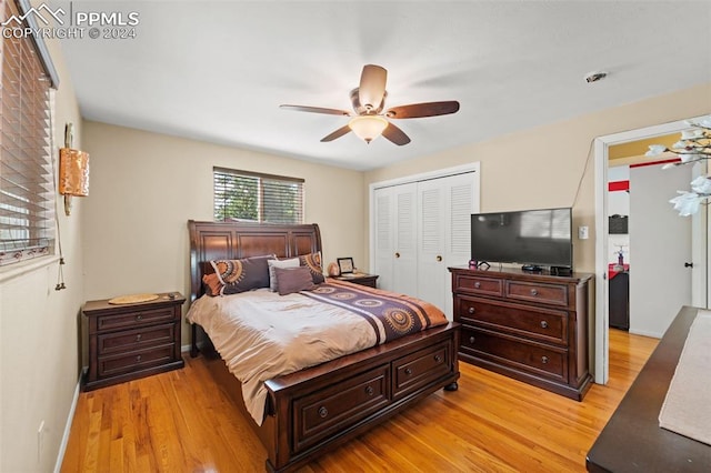 bedroom with a closet, ceiling fan, and light hardwood / wood-style floors