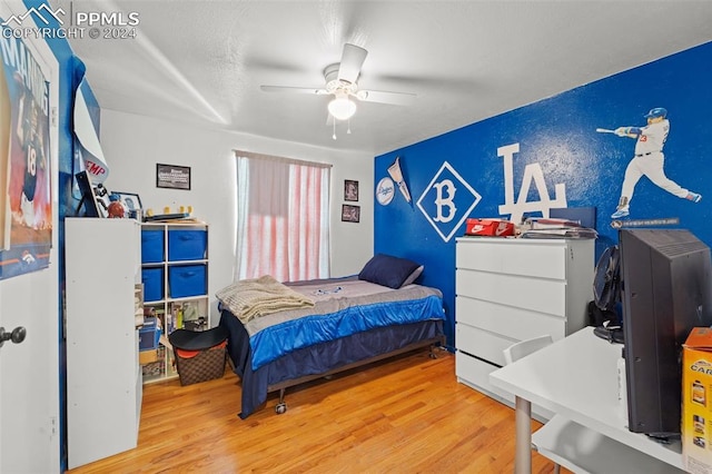 bedroom featuring hardwood / wood-style floors and ceiling fan