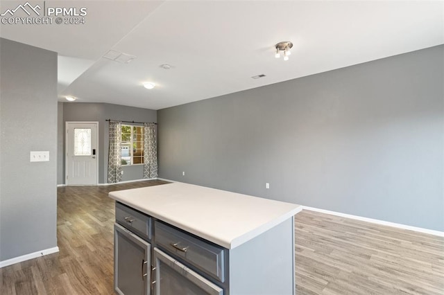 kitchen featuring light hardwood / wood-style flooring and a kitchen island