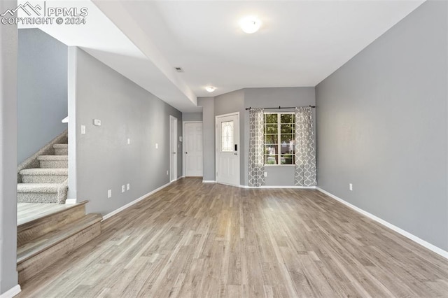 unfurnished living room with light hardwood / wood-style floors