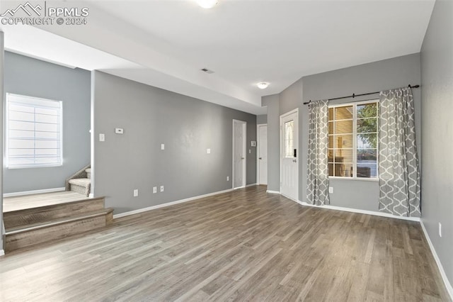 interior space featuring a healthy amount of sunlight and hardwood / wood-style floors