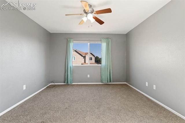 unfurnished room with carpet and ceiling fan