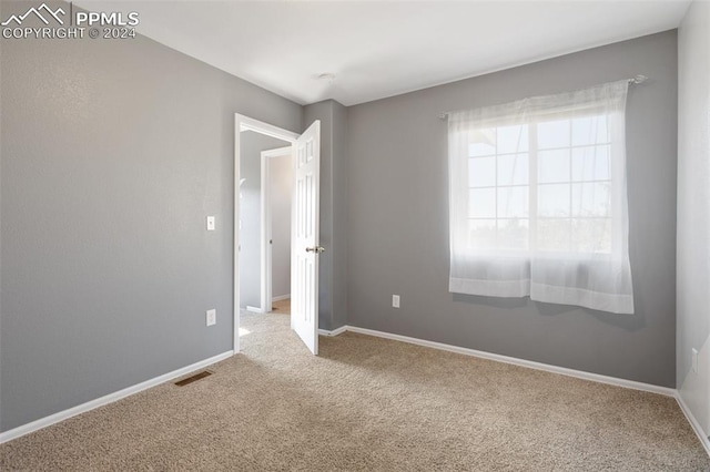 empty room featuring carpet floors