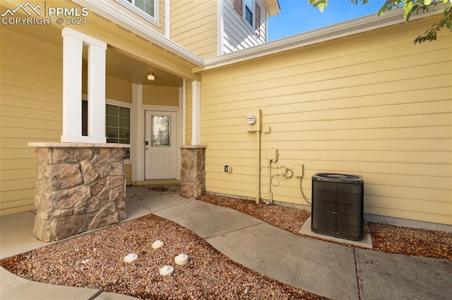 view of patio featuring a porch and central air condition unit