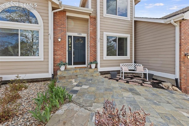 doorway to property with a patio