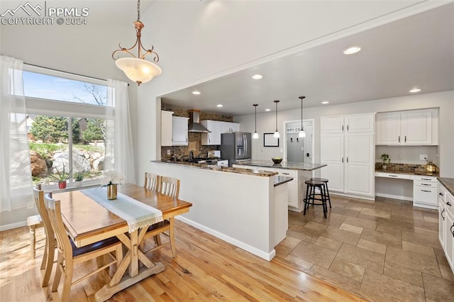 dining space featuring light hardwood / wood-style flooring