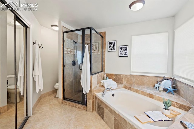 bathroom with separate shower and tub and toilet