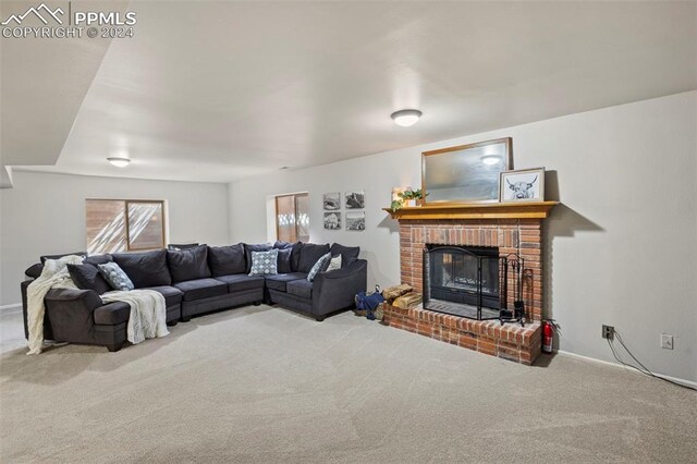 carpeted living room with a fireplace