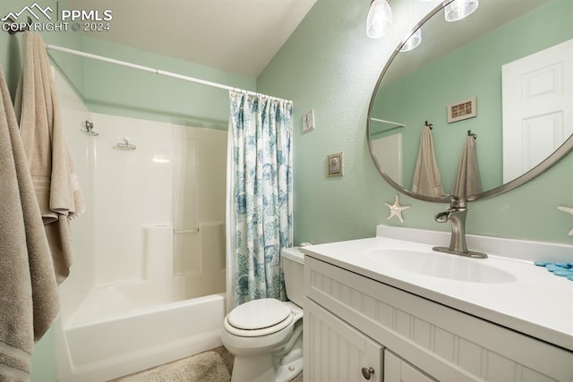 full bathroom with vanity, toilet, and shower / tub combo with curtain