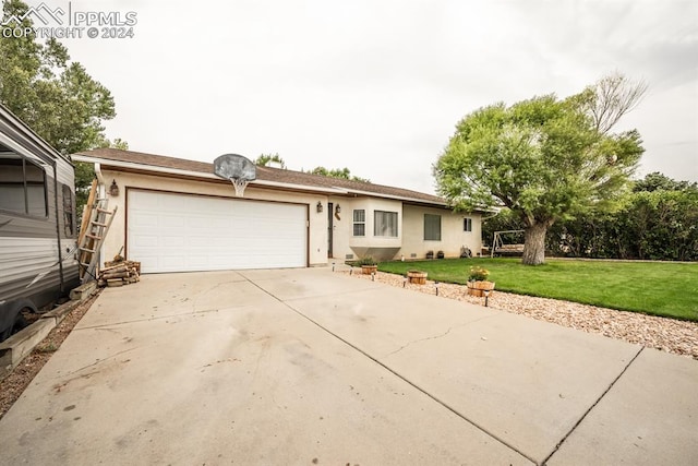 ranch-style home with a garage and a front yard