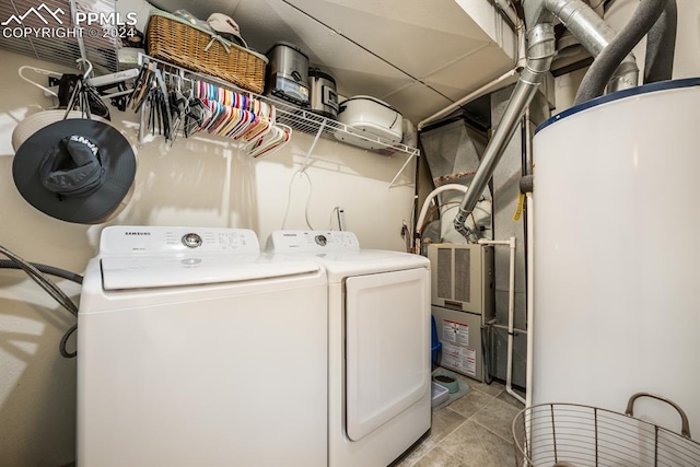 laundry area featuring light tile patterned floors and washer and dryer