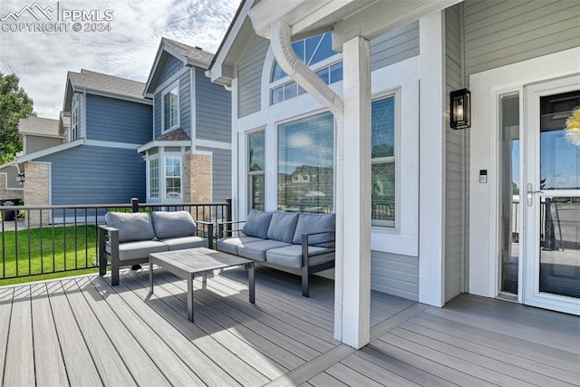 wooden terrace featuring outdoor lounge area and grilling area