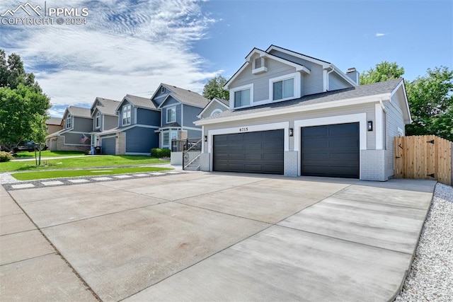 view of front facade featuring a garage and a front yard