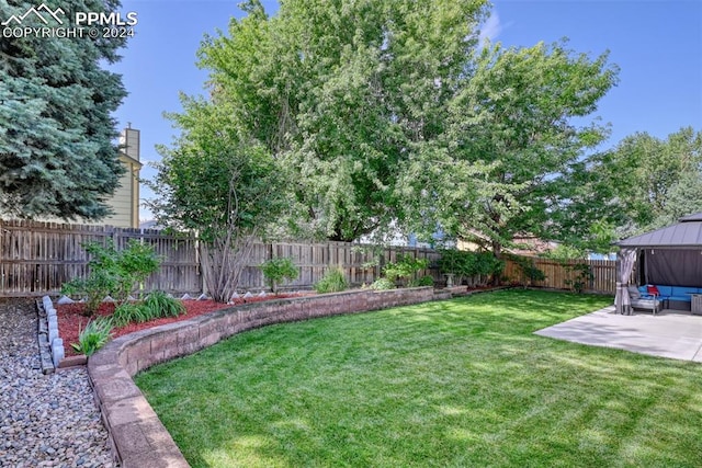 view of yard featuring a gazebo, a patio, and an outdoor hangout area