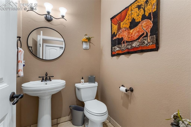 bathroom with sink and toilet