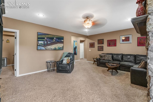 carpeted living room featuring ceiling fan