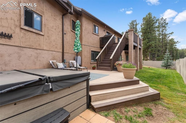 wooden deck with a lawn