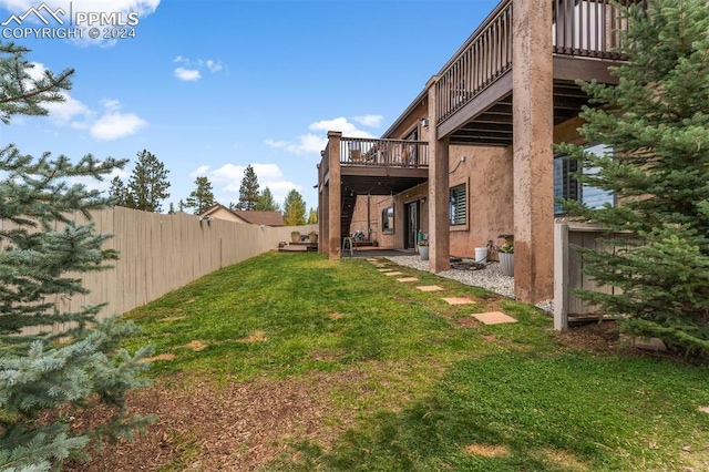 view of yard with a deck