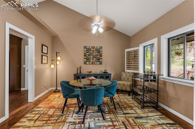 dining space with lofted ceiling, ceiling fan, and hardwood / wood-style flooring