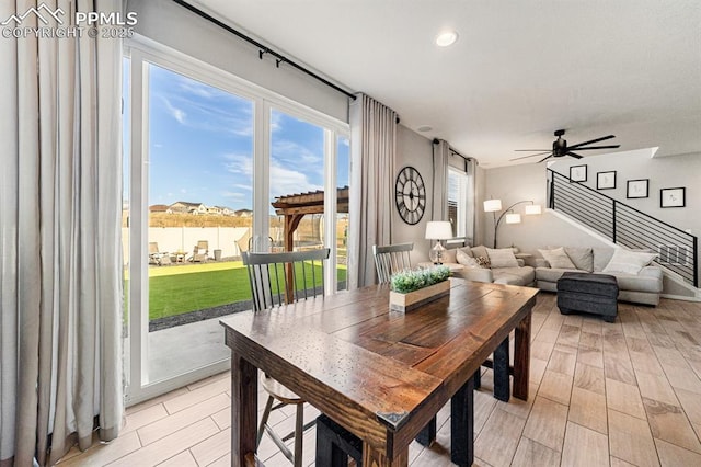 dining space with ceiling fan