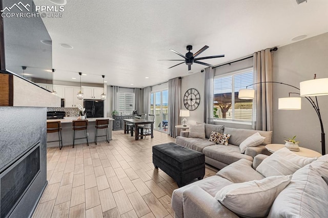 living room with ceiling fan