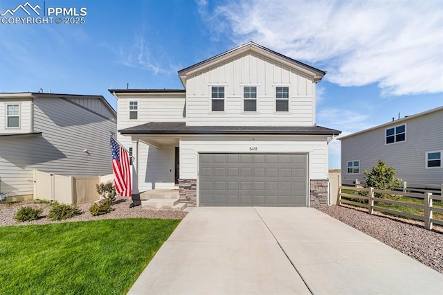 view of front facade with a front yard and a garage