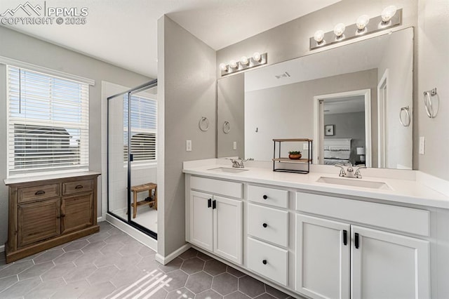 bathroom with vanity, tile patterned floors, and a shower with shower door